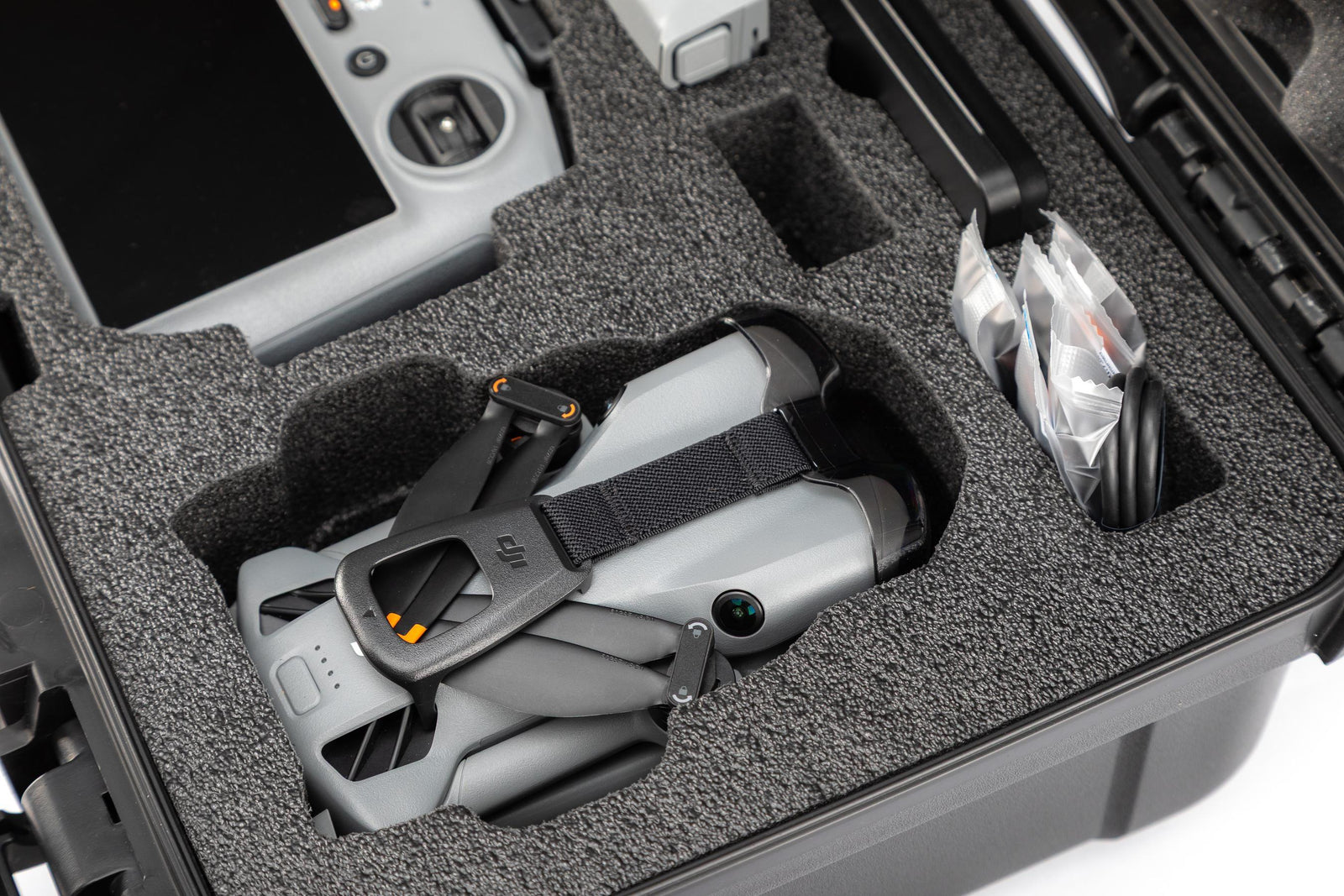 Gray protective case with a helmet and tools inside