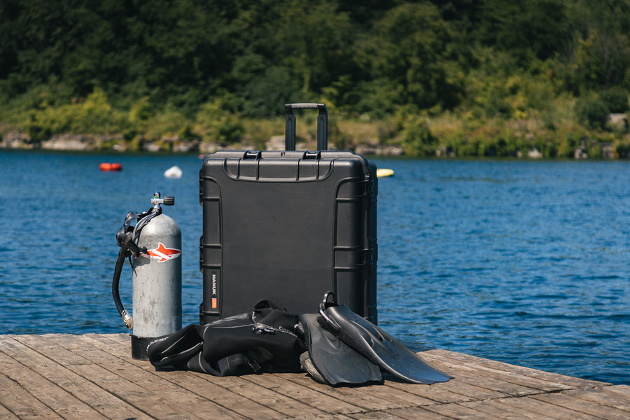 Nanuk 976 on a wooden deck with diving gears