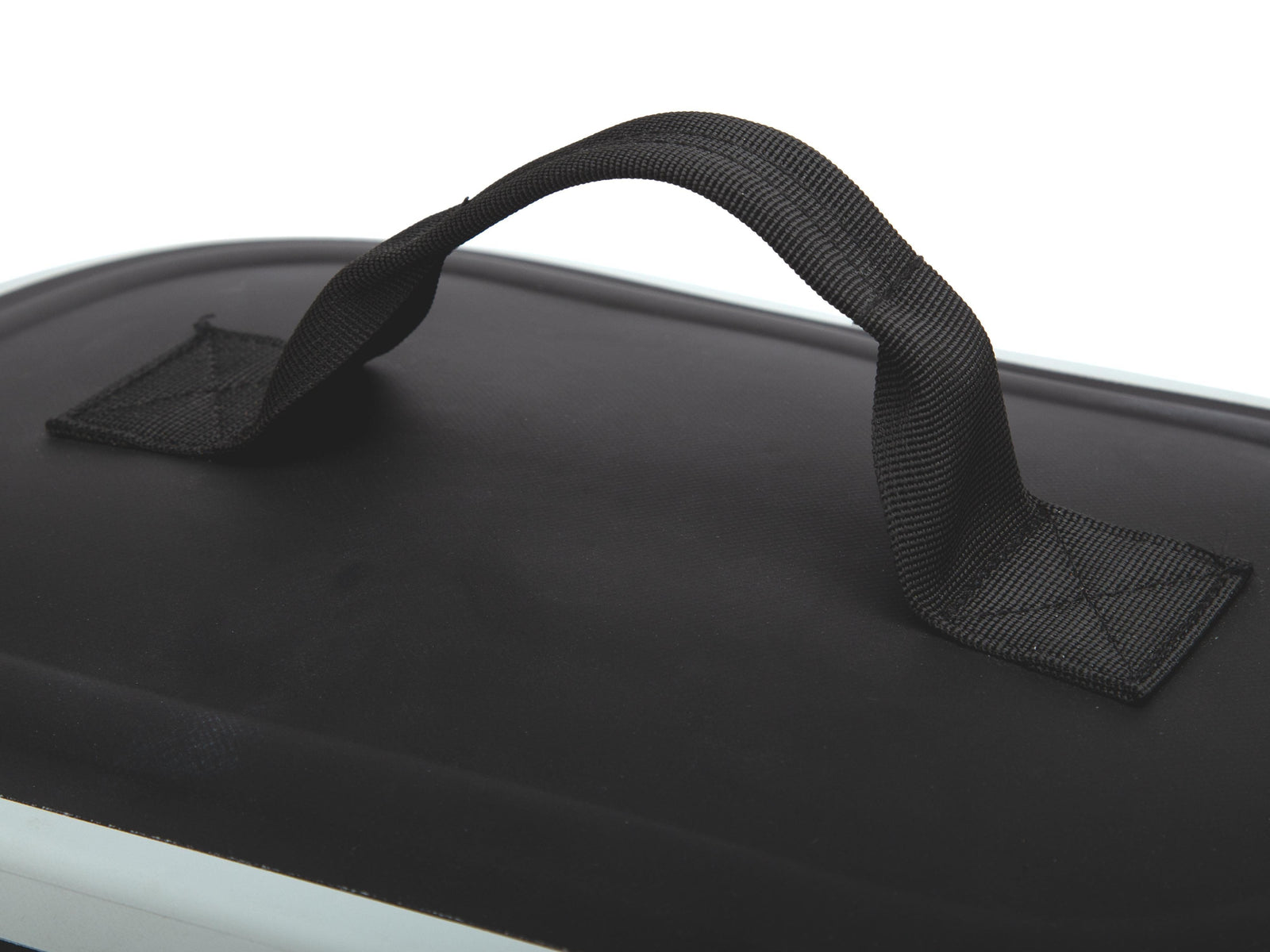 Close-up of a black hard case or bag with a padded top handle, photographed against a white background.