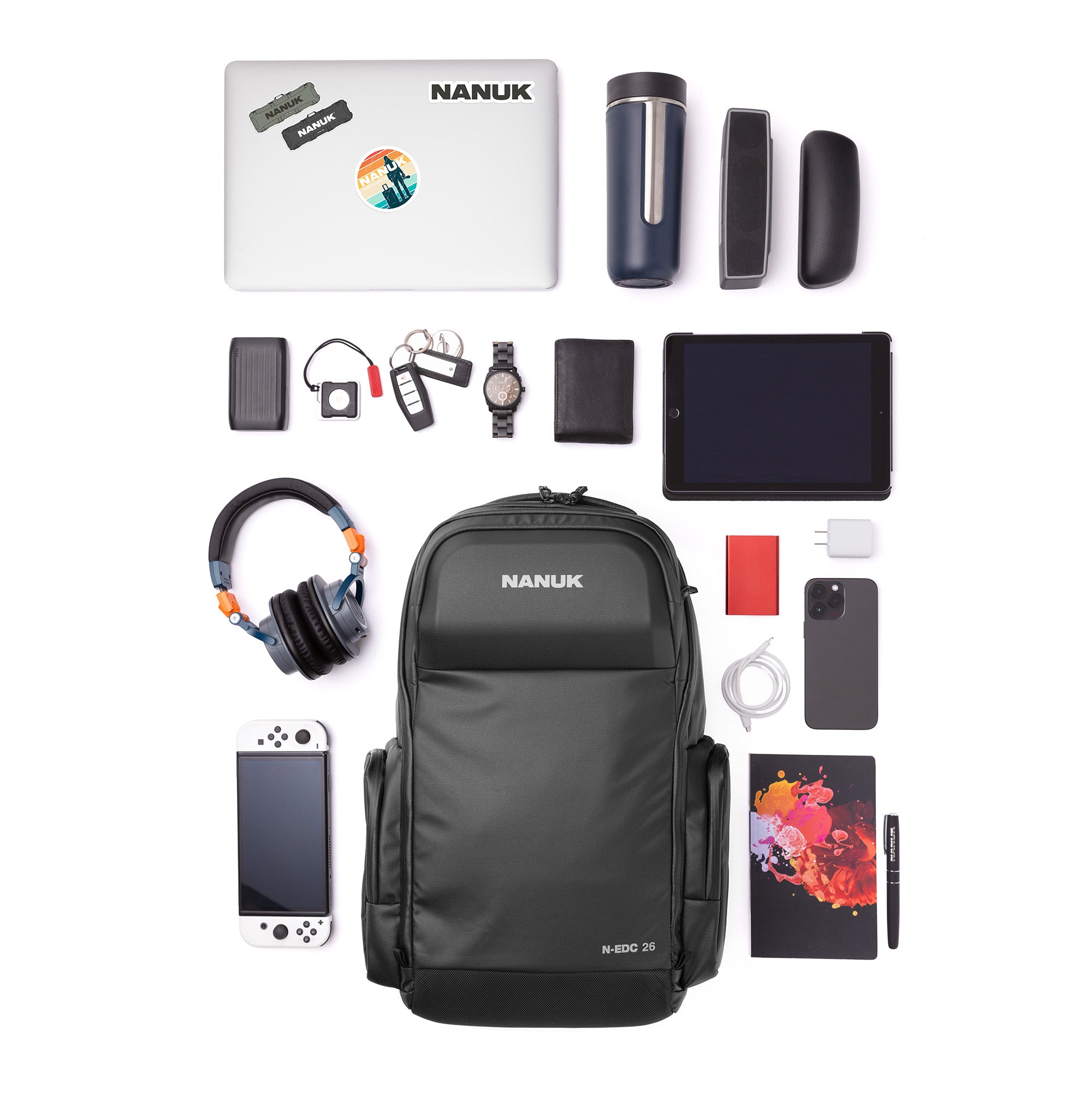 Collection of electronic devices and accessories with a NANUK backpack on a white background Collection of electronic devices and accessories with a NANUK backpack on a white background