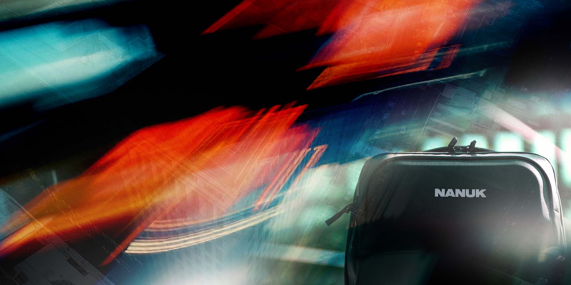 Nanuk backpack held by a person with colorful blurred lights in the background