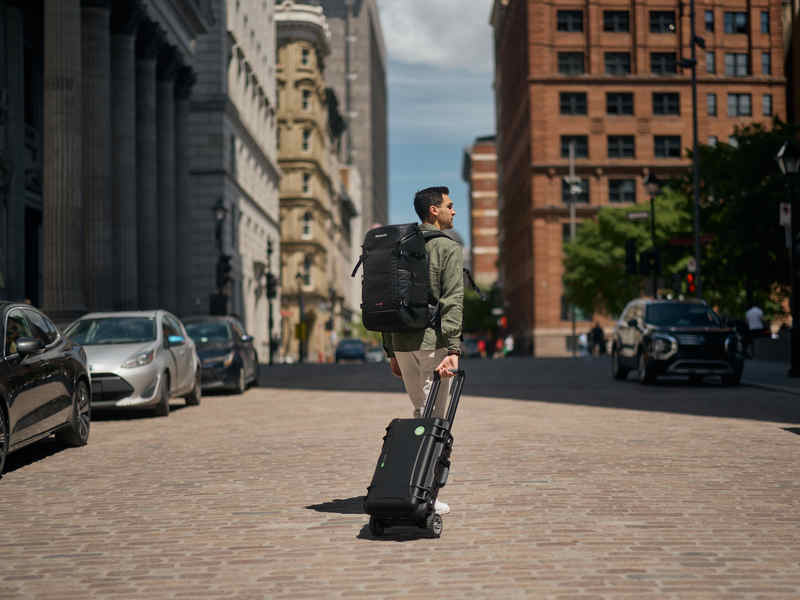 Photographer carrying NANUK 935 with HDW in the city