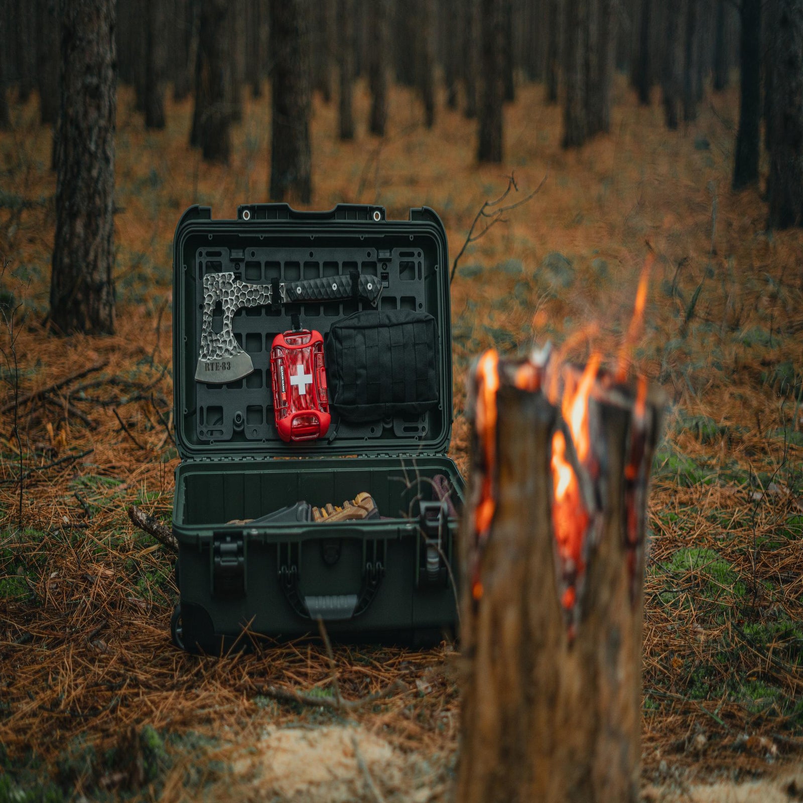 Open black tool case with tools in a forest setting