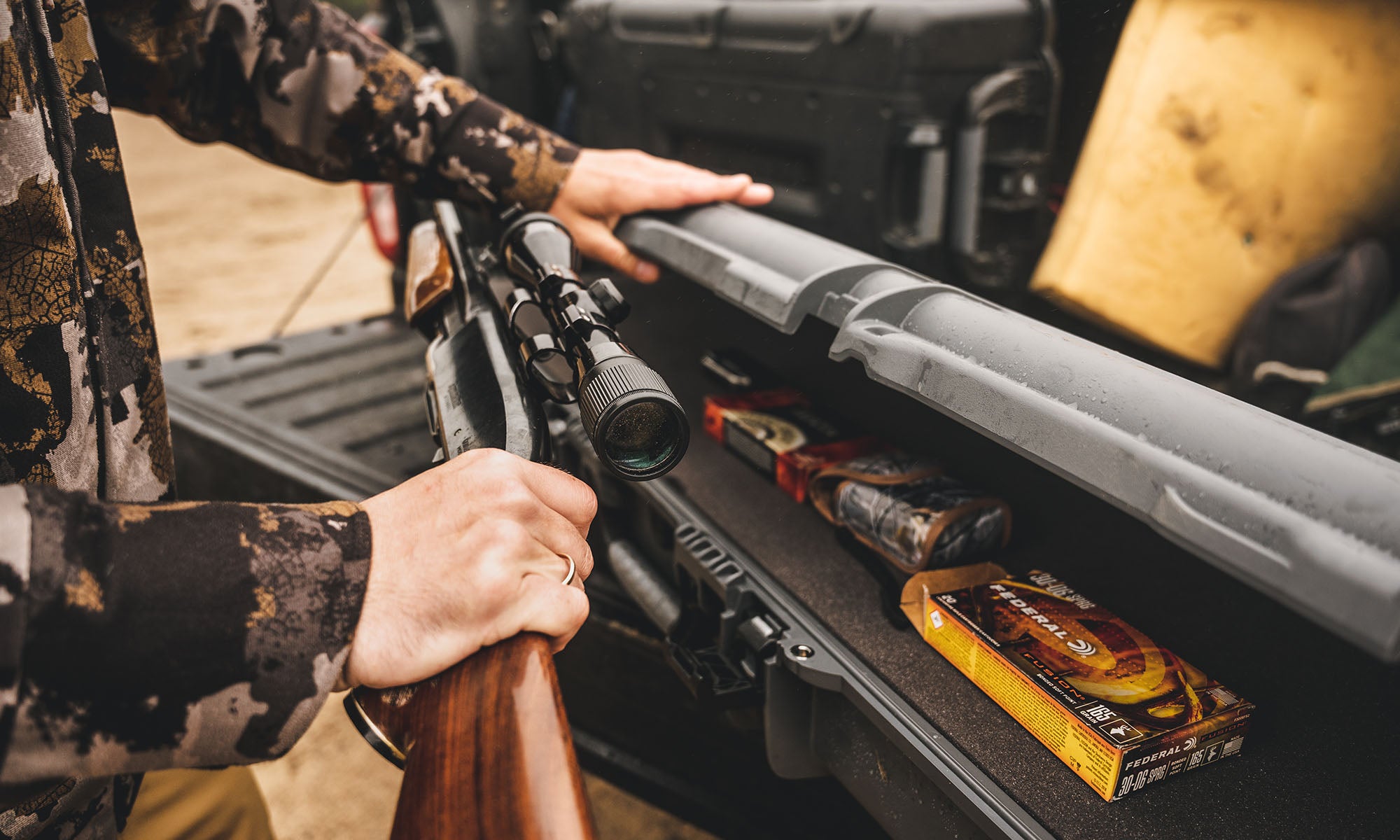 Hunter taking out his rifle from the Nanuk long case