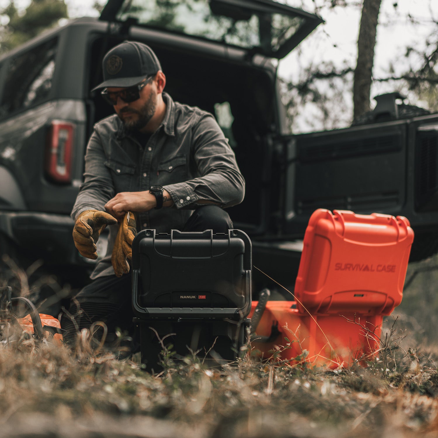 Hunter placing gears in the Nanuk 938 Survival and Nanuk T30