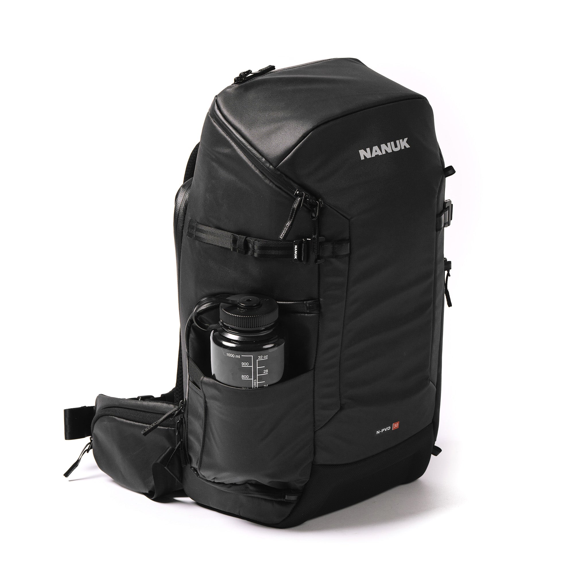 Right Angle view of a Black N-PVD 30L Camera Backpack with a water bottle from NANUK on a white background Right Angle view of a Black N-PVD 30L Camera Backpack with a water bottle from NANUK on a white background