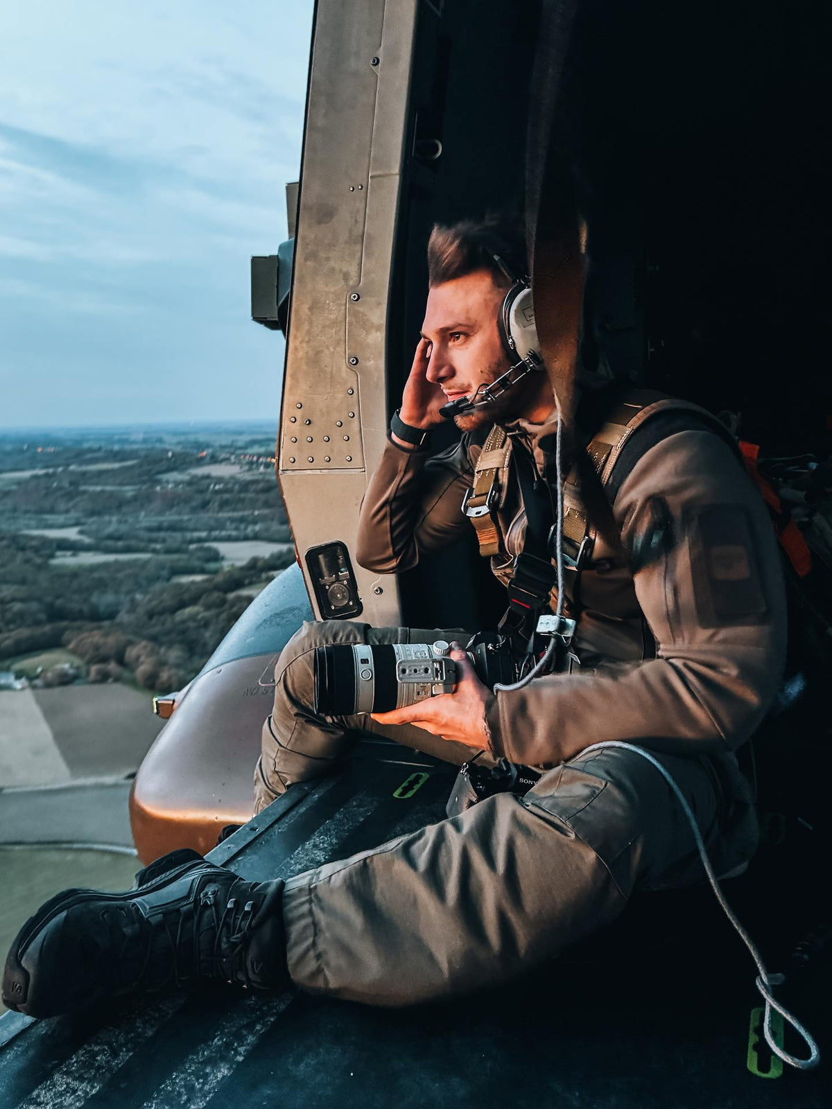 Person inside a helicopter with a scenic view outside