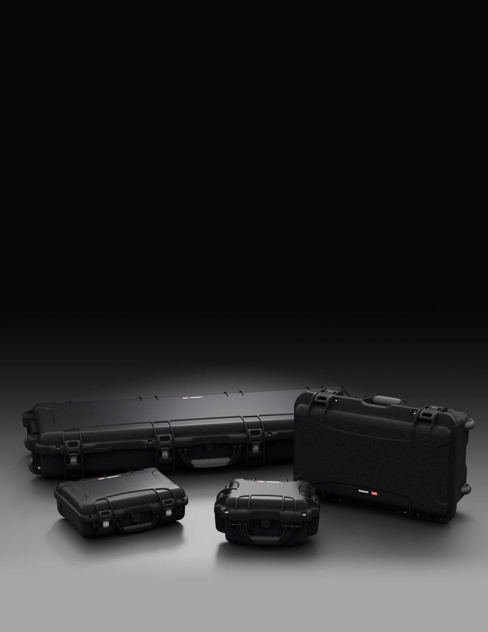 Collection of black NANUK hard cases of different sizes, highlighting durable and protective gear storage