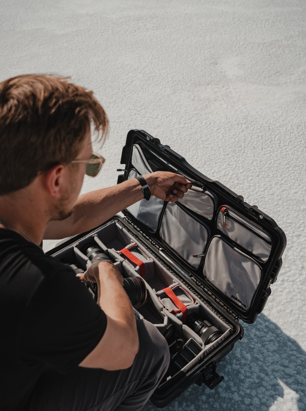 Professional Photographer looking into his NANUKL Pro Photo Kit Case