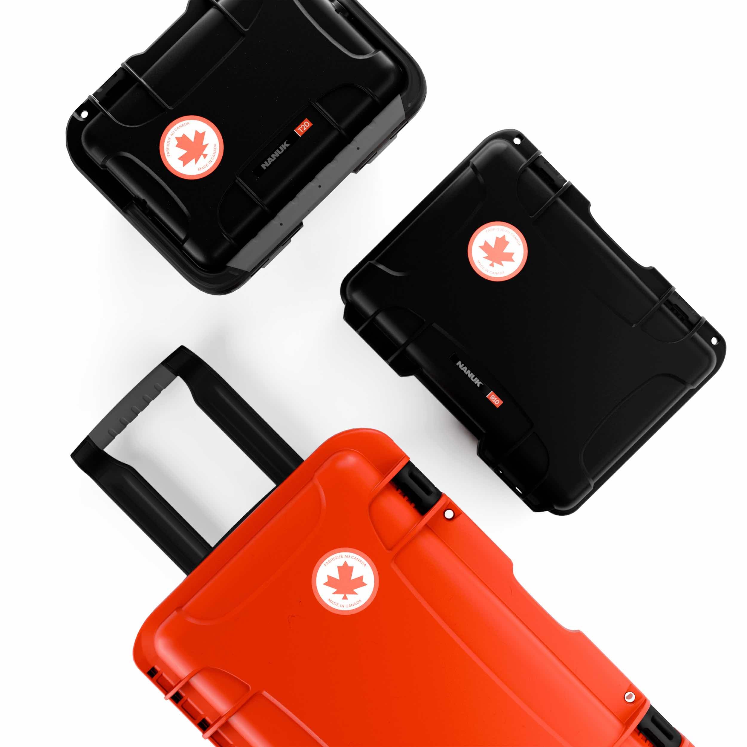 Top view of black and red NANUK hard cases with Canadian labels, featuring durable gear protection