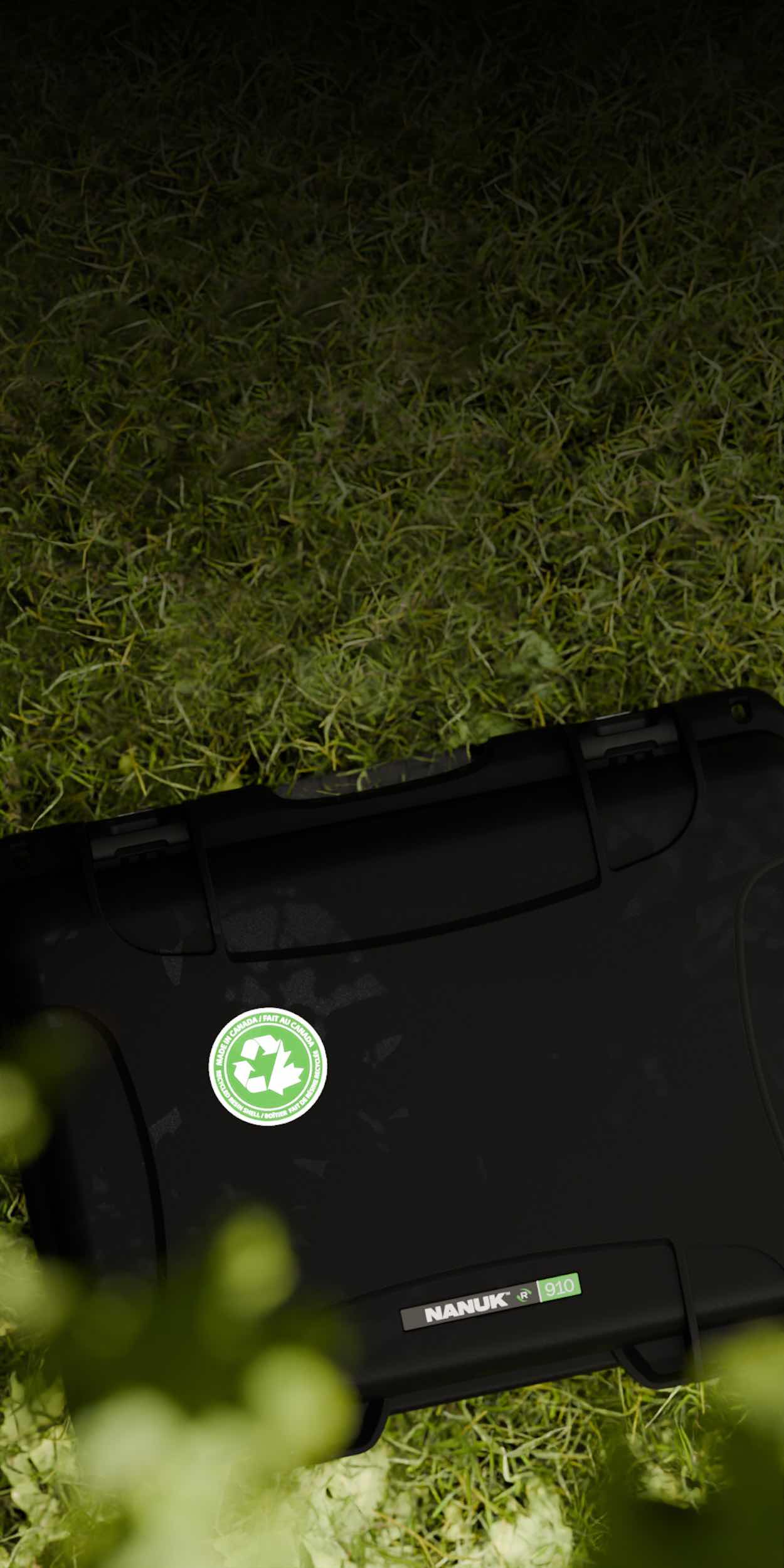 NANUK hard cases on grass highlighting gear protection and eco-friendly packaging for resellers