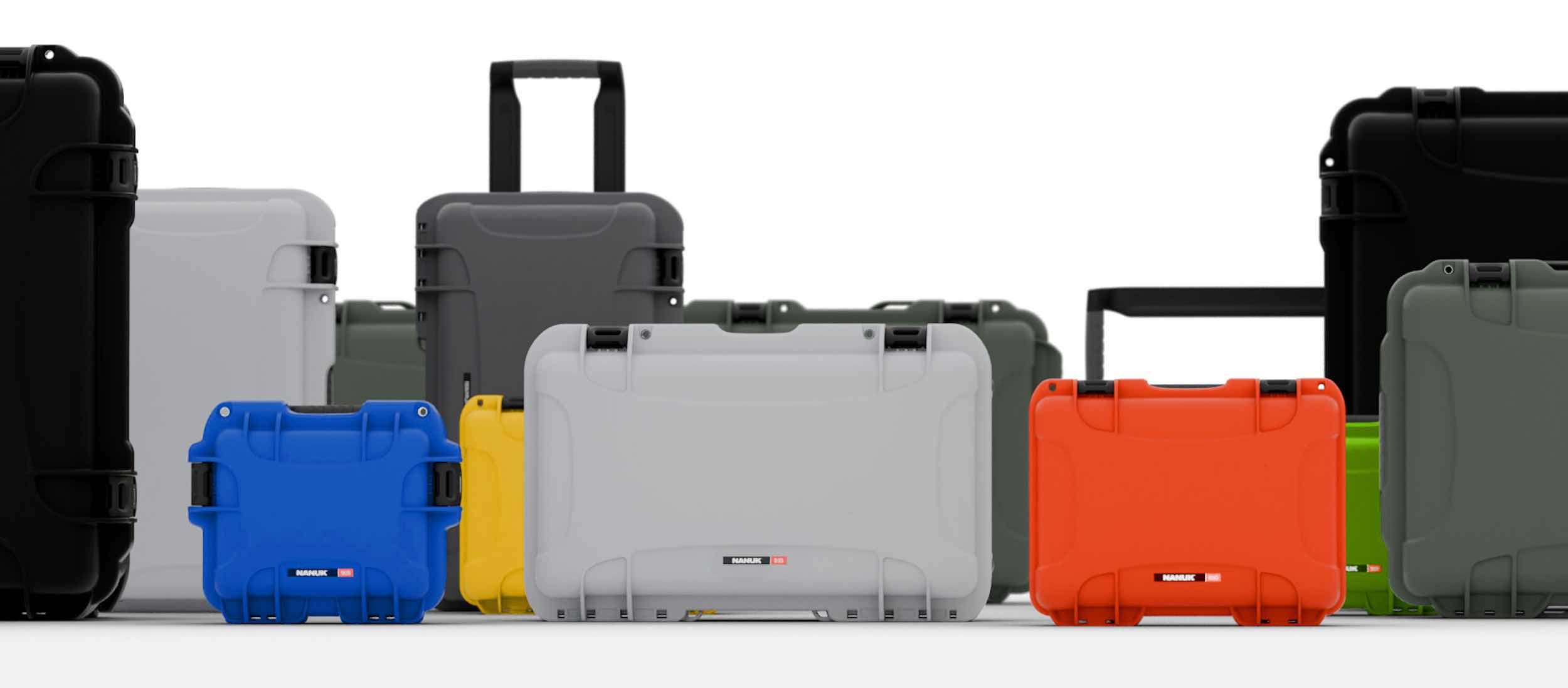 Various sizes and colors of NANUK hard cases lined up, demonstrating versatile and durable gear protection solutions